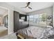 Bedroom with large window, built-in storage and ensuite bathroom at 937 Walnut Creek Ln, Poinciana, FL 34759