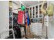 Spacious walk-in closet with custom shelving, cabinets, drawers and space to store shoes and hang clothes at 937 Walnut Creek Ln, Poinciana, FL 34759