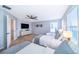 This spacious bedroom offers three beds, a ceiling fan, and stylish decor at 1113 Pine Ridge Dr, Davenport, FL 33896