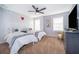 Stylish bedroom featuring two twin beds, playful decor, and plenty of natural light from the large window at 1113 Pine Ridge Dr, Davenport, FL 33896