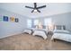 Well-lit bedroom with three twin beds and large windows at 1113 Pine Ridge Dr, Davenport, FL 33896