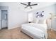 Cozy bedroom featuring neutral walls, carpet flooring, and a well-lit space with simple, elegant furnishings at 1113 Pine Ridge Dr, Davenport, FL 33896