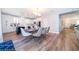 Open-concept kitchen and dining area, featuring a central island and modern appliances at 1113 Pine Ridge Dr, Davenport, FL 33896