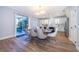 Bright dining room with modern table and chairs, flowing out to the pool and patio area at 1113 Pine Ridge Dr, Davenport, FL 33896
