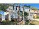 Charming two-story home with a well-manicured lawn and attached two-car garage at 1113 Pine Ridge Dr, Davenport, FL 33896