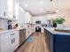 Modern kitchen featuring white cabinets, stainless steel appliances and a kitchen island at 1113 Pine Ridge Dr, Davenport, FL 33896