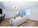 Comfortable living room with large window, neutral tones, and sleek flooring at 1113 Pine Ridge Dr, Davenport, FL 33896