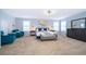 Bright main bedroom showcasing a king bed, comfortable seating, and modern furnishings at 1113 Pine Ridge Dr, Davenport, FL 33896