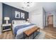 Stylishly decorated bedroom featuring an accent wall and modern furnishings at 1113 Pine Ridge Dr, Davenport, FL 33896