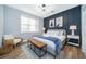 Stylishly decorated bedroom featuring an accent wall and modern furnishings at 1113 Pine Ridge Dr, Davenport, FL 33896