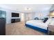 Large main bedroom features a king bed, ensuite bathroom, and elegant decor at 1113 Pine Ridge Dr, Davenport, FL 33896