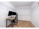 Bright office with a modern desk, dual monitors, carpet, and ample shelving at 1113 Pine Ridge Dr, Davenport, FL 33896