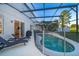 Screened pool with lounge chairs provides a private and relaxing outdoor living space at 1113 Pine Ridge Dr, Davenport, FL 33896