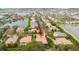 Charming aerial image of the home in a peaceful, tree-lined neighborhood near lakes and recreation at 11856 Vinci Dr, Windermere, FL 34786