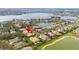 Gorgeous aerial shot of the house, boasting a private pool and scenic water views at 11856 Vinci Dr, Windermere, FL 34786