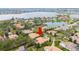 Stunning aerial view of the home nestled in a lush neighborhood near a serene lake at 11856 Vinci Dr, Windermere, FL 34786