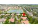 Expansive aerial view showcasing the house and its proximity to parks and a lake at 11856 Vinci Dr, Windermere, FL 34786