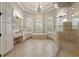Bright bathroom featuring a soaking tub, walk-in shower, and dual vanities at 11856 Vinci Dr, Windermere, FL 34786