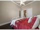 This well lit bedroom has an ensuite bath and a ceiling fan at 11856 Vinci Dr, Windermere, FL 34786