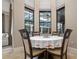 Cozy breakfast nook with bright light from three large windows and views to outdoor living area at 11856 Vinci Dr, Windermere, FL 34786