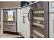 Stainless steel wine fridge, beverage fridge, granite countertops, and white cabinets in kitchen island at 11856 Vinci Dr, Windermere, FL 34786