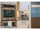 Modern kitchen with stainless steel appliances, built in ovens, espresso machine and granite countertops at 11856 Vinci Dr, Windermere, FL 34786