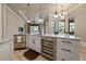 Kitchen island featuring stainless steel wine fridge, beverage fridge and granite countertop at 11856 Vinci Dr, Windermere, FL 34786