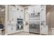Kitchen featuring white cabinets, stainless steel appliances, and granite countertops at 11856 Vinci Dr, Windermere, FL 34786