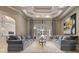 An open-concept floorplan featuring high ceilings, tile floors, two sofas and an adjacent outdoor patio at 11856 Vinci Dr, Windermere, FL 34786