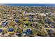 Aerial view of neighborhood with homes with mature trees near a large waterway at 1205 Wisconsin Ave, St Cloud, FL 34769