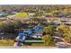 Aerial view of home featuring fenced yard with above ground pool and mature trees at 1205 Wisconsin Ave, St Cloud, FL 34769