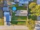 Aerial view of home showing the fenced yard with above ground pool and mature trees at 1205 Wisconsin Ave, St Cloud, FL 34769