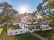 Aerial view of charming home with well-manicured lawn at 1205 Wisconsin Ave, St Cloud, FL 34769