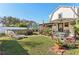 Spacious backyard with lush lawn, above ground pool, and patio dining set for entertaining at 1205 Wisconsin Ave, St Cloud, FL 34769