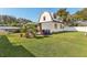 Lawn and white-sided house exterior at 1205 Wisconsin Ave, St Cloud, FL 34769
