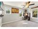 Bedroom with neutral walls, carpeting, ceiling fan, and modern wall decor at 1205 Wisconsin Ave, St Cloud, FL 34769