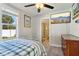 Comfortable bedroom with an en-suite bathroom and views of the backyard through a window at 1205 Wisconsin Ave, St Cloud, FL 34769