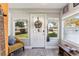 Bright entryway with a welcoming wreath on the front door, offering curb appeal at 1205 Wisconsin Ave, St Cloud, FL 34769