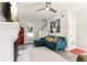 A sun-drenched living room showcases a fireplace, a sectional sofa, and stairs to the next floor at 1205 Wisconsin Ave, St Cloud, FL 34769