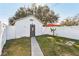 Cozy backyard featuring a shed, white fence, and tranquil outdoor space at 1205 Wisconsin Ave, St Cloud, FL 34769