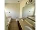 Bathroom featuring a double vanity, bath tub, and tile flooring at 14320 Desert Haven St # 3906, Windermere, FL 34786