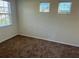 Bedroom with carpeted floors and natural light shining through the windows at 14320 Desert Haven St # 3906, Windermere, FL 34786