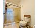 This bathroom features a glass-enclosed shower and tiled flooring, offering a clean and modern design at 1509 Portofino Meadows Blvd, Orlando, FL 32824