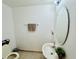 Neat half bathroom featuring a mirror, towel rack, sink, and toilet at 1509 Portofino Meadows Blvd, Orlando, FL 32824