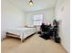 Bedroom features a bed, large window, and a desk with a computer setup at 1509 Portofino Meadows Blvd, Orlando, FL 32824