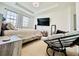 Bedroom with a ceiling fan, large windows, and a chair at 1509 Portofino Meadows Blvd, Orlando, FL 32824