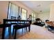 Open dining area with large sliding glass doors, lots of light, and space for exercise equipment at 1509 Portofino Meadows Blvd, Orlando, FL 32824