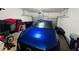 View of garage with blue car parked inside at 1509 Portofino Meadows Blvd, Orlando, FL 32824