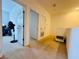 Upstairs hallway leads to a functional space with natural light, offering a versatile area for various needs at 1509 Portofino Meadows Blvd, Orlando, FL 32824