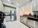 Well-equipped kitchen with stainless steel appliances, granite countertops, and plenty of storage at 1509 Portofino Meadows Blvd, Orlando, FL 32824